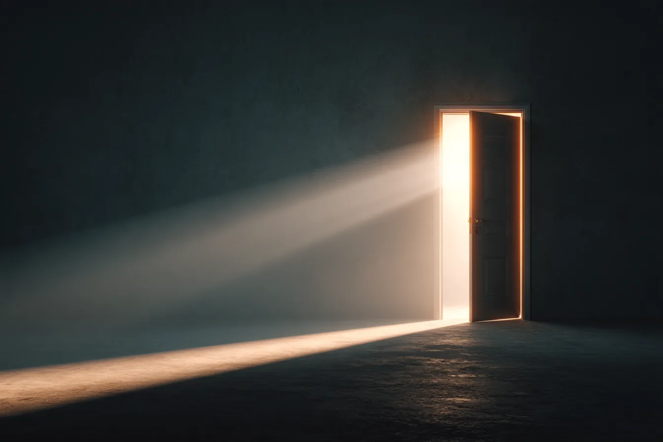 A door ajar onto a bright, empty room, morning light spilling across the floor
